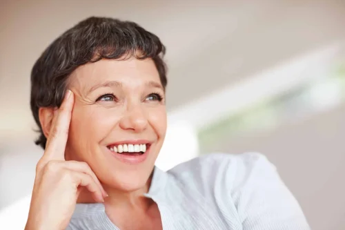 happy moments closeup happy mature woman smiling while looking away